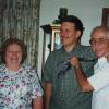 Sharon, Miller=Tawney, with Bruce Wells and Ed Bruder clowning around after singing for a friend at her 90th birthday. 